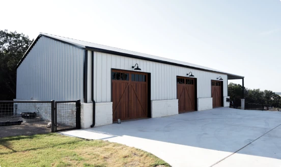 Three bay white metal residential garage.